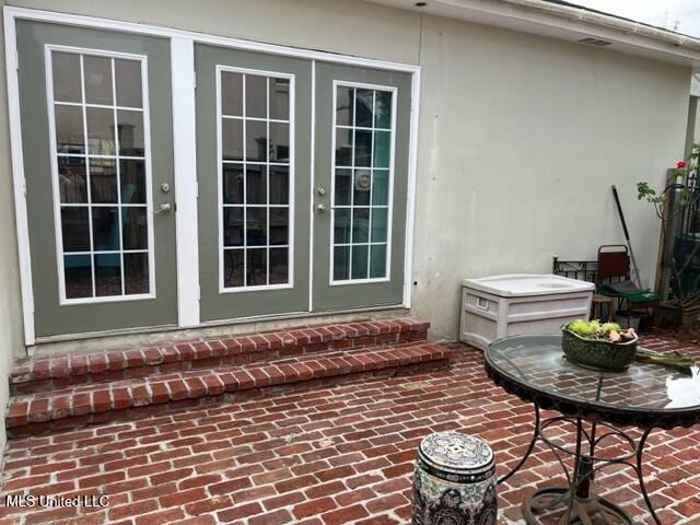 1916 2nd St Unit 2, Gulfport, MS 39501 - exterior space featuring stucco siding and french doors