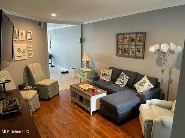 1916 2nd St Unit 2, Gulfport, MS 39501 - living room featuring ornamental molding, recessed lighting, and wood finished floors