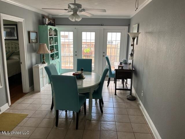 1916 2nd St Unit 2, Gulfport, MS 39501 - dining space featuring french doors, ornamental molding, a ceiling fan, light tile patterned floors, and a textured wall
