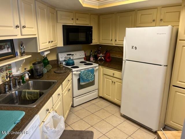 1916 2nd St Unit 2, Gulfport, MS 39501 - kitchen with white appliances, light tile patterned floors, and dark countertops