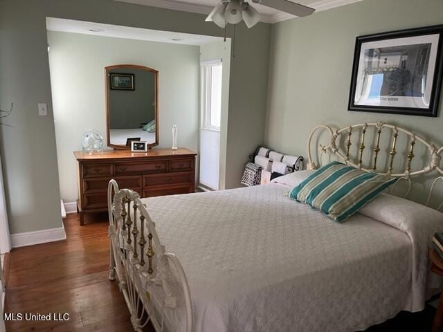 1916 2nd St Unit 2, Gulfport, MS 39501 - bedroom with dark wood-type flooring, crown molding, arched walkways, and ceiling fan