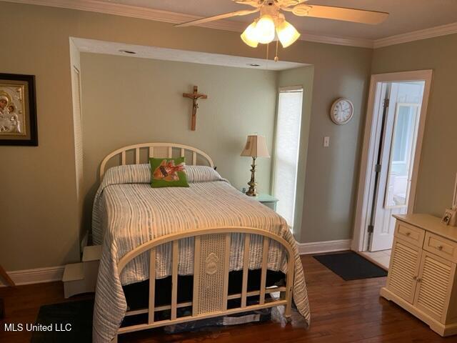 1916 2nd St Unit 2, Gulfport, MS 39501 - bedroom featuring wood finished floors, ornamental molding, and ceiling fan