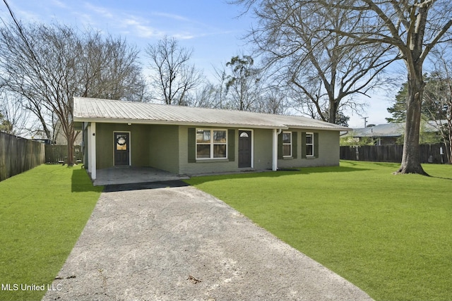 single story home with brick siding, driveway, metal roof, and a front yard