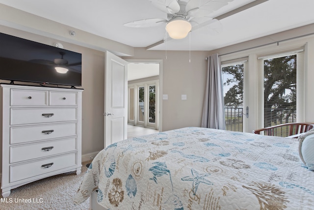 carpeted bedroom with ceiling fan and access to exterior