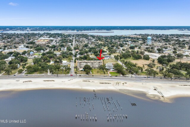 birds eye view of property featuring a water view and a view of the beach