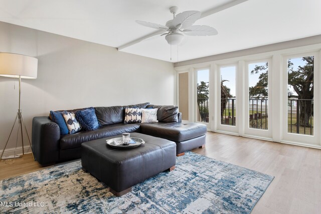 living room featuring hardwood / wood-style flooring and ceiling fan