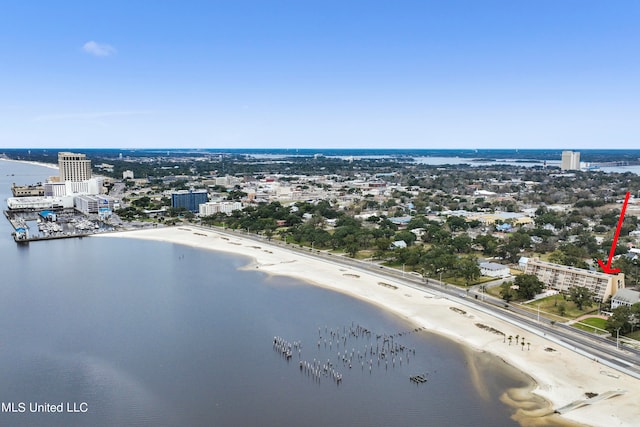 aerial view with a water view and a beach view