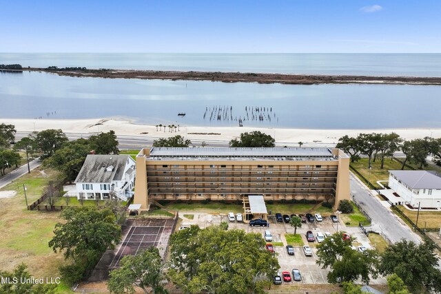 bird's eye view featuring a water view and a view of the beach