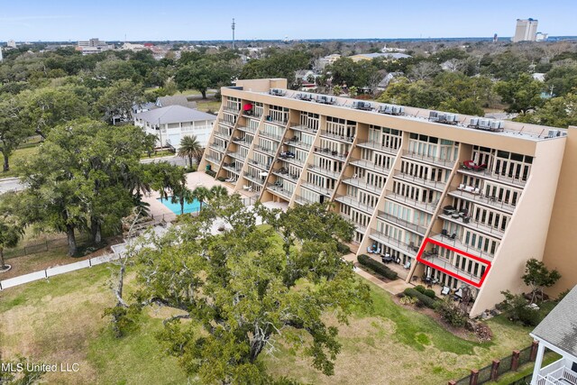 view of property featuring a community pool