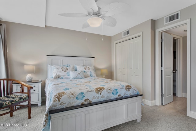 carpeted bedroom with a closet and ceiling fan