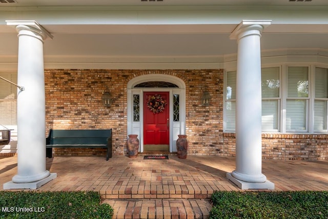 305 Creekbend Rd, Natchez, MS 39120 - doorway to property with covered porch and brick siding