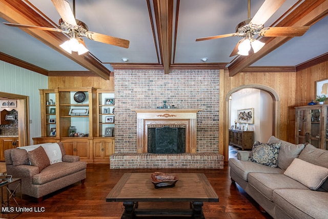 living room featuring dark hardwood / wood-style flooring, wood walls, and beam ceiling