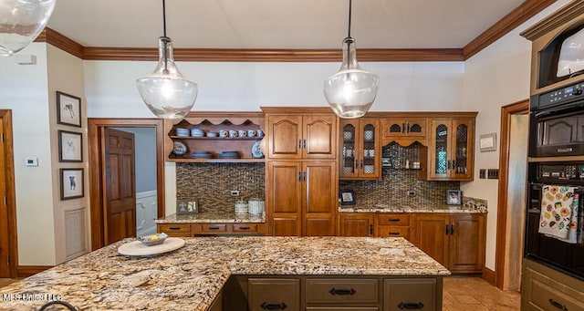 305 Creekbend Rd, Natchez, MS 39120 - kitchen featuring decorative backsplash, brown cabinets, glass insert cabinets, hanging light fixtures, and crown molding