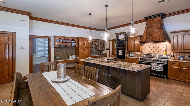 305 Creekbend Rd, Natchez, MS 39120 - kitchen with high end range, premium range hood, tasteful backsplash, a center island, and crown molding