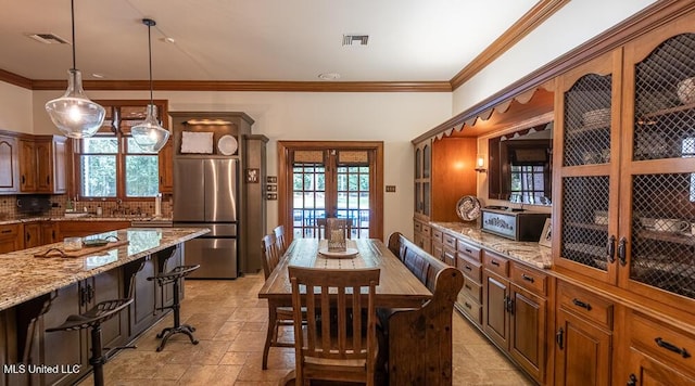 305 Creekbend Rd, Natchez, MS 39120 - dining room featuring french doors, plenty of natural light, crown molding, and stone tile flooring