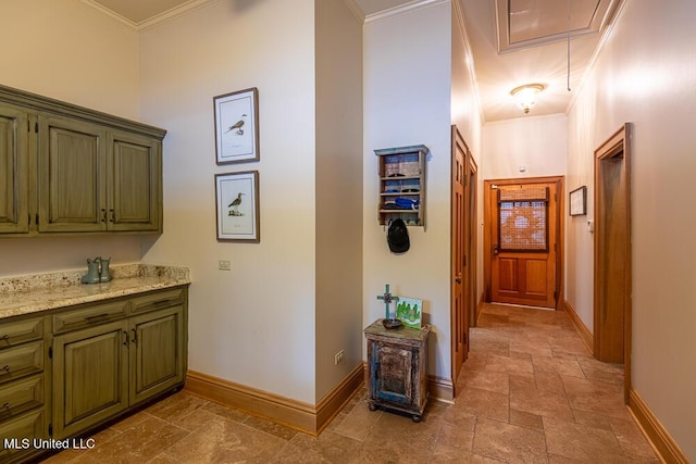305 Creekbend Rd, Natchez, MS 39120 - hallway featuring attic access, stone tile floors, and ornamental molding
