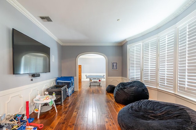 305 Creekbend Rd, Natchez, MS 39120 - living room with hardwood / wood-style floors, arched walkways, wainscoting, and crown molding