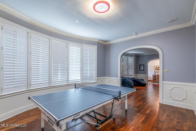 305 Creekbend Rd, Natchez, MS 39120 - rec room with arched walkways, a wainscoted wall, crown molding, and hardwood / wood-style flooring