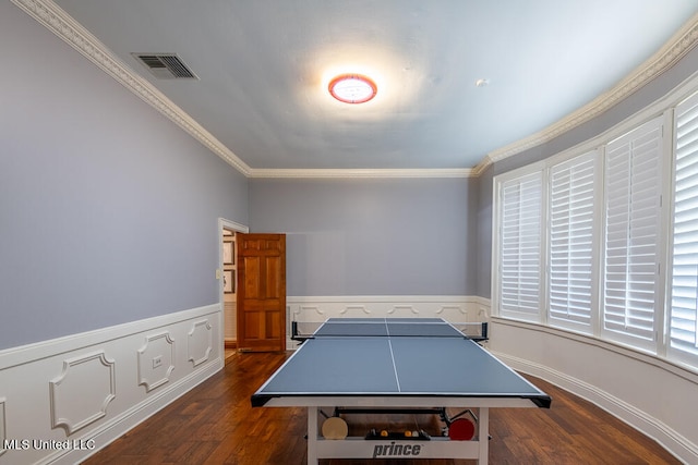 recreation room featuring dark hardwood / wood-style flooring and ornamental molding