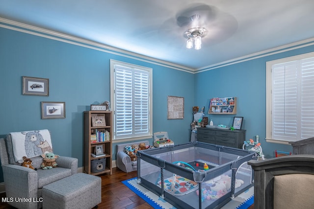 bedroom with ceiling fan, dark hardwood / wood-style flooring, and ornamental molding