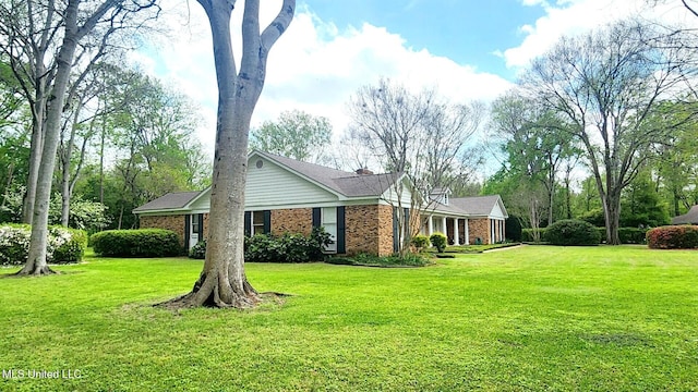 305 Creekbend Rd, Natchez, MS 39120 - view of side of property featuring brick siding and a lawn