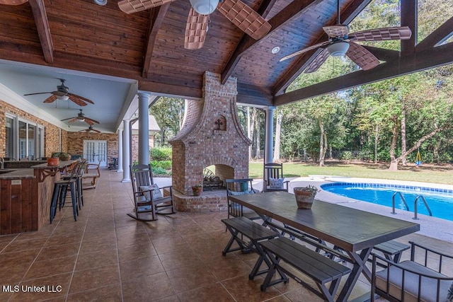 305 Creekbend Rd, Natchez, MS 39120 - view of patio / terrace with an outdoor brick fireplace, ceiling fan, a bar, and an outdoor pool