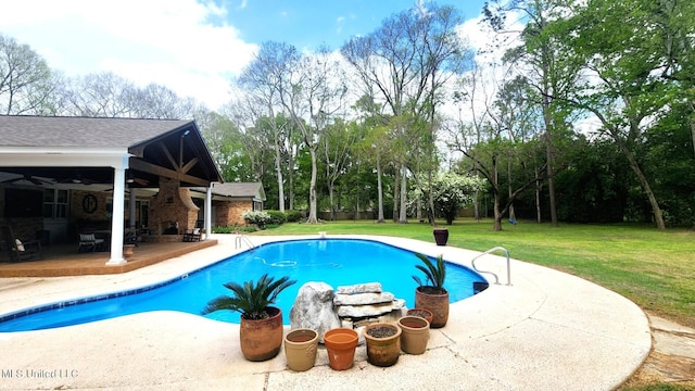 305 Creekbend Rd, Natchez, MS 39120 - swimming pool featuring a patio, ceiling fan, a lawn, and view of wooded area