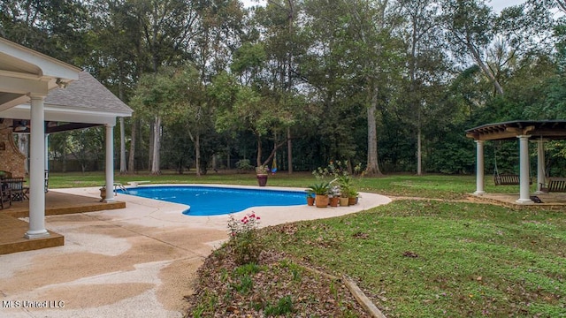305 Creekbend Rd, Natchez, MS 39120 - outdoor pool with a patio, a lawn, view of wooded area, and a ceiling fan