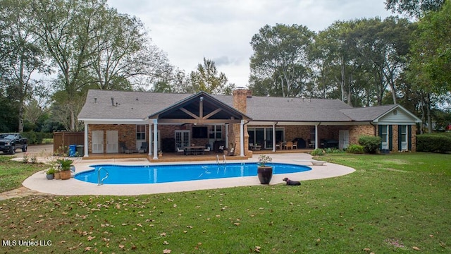 305 Creekbend Rd, Natchez, MS 39120 - outdoor pool with a patio area, a yard, and french doors