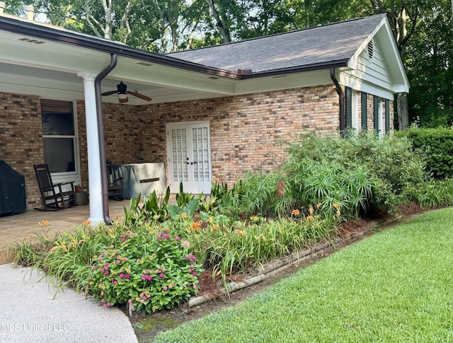 305 Creekbend Rd, Natchez, MS 39120 - entrance to property featuring a ceiling fan, brick siding, french doors, and roof with shingles