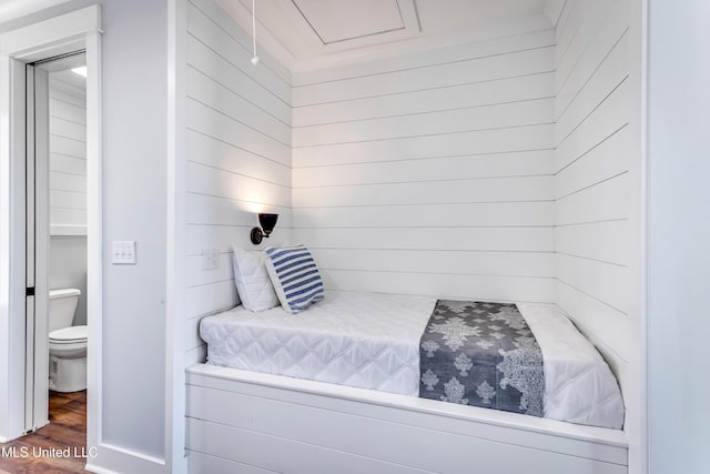 bedroom with wood-type flooring