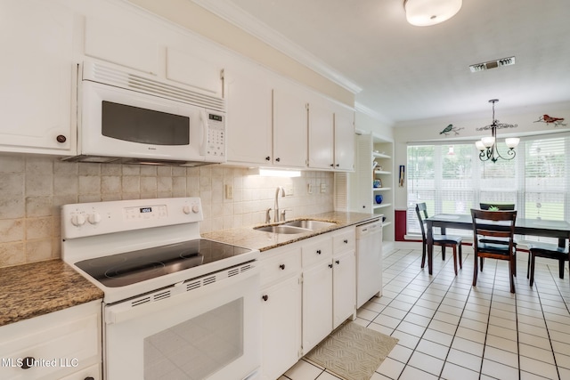 1 Partridge Pl, Long Beach, MS 39560 - kitchen with white appliances, a sink, white cabinets, tasteful backsplash, and crown molding