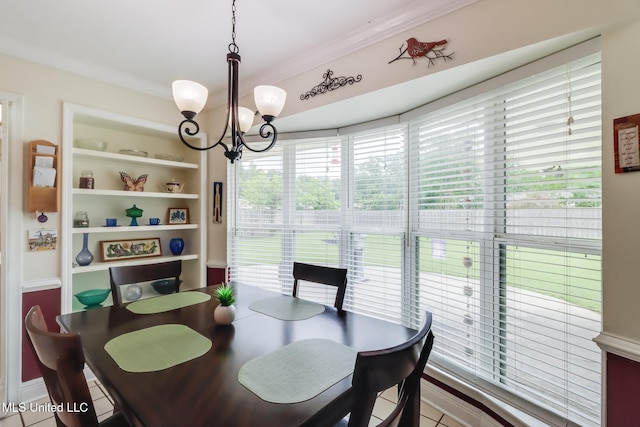 1 Partridge Pl, Long Beach, MS 39560 - tiled dining space with a chandelier, ornamental molding, and built in shelves