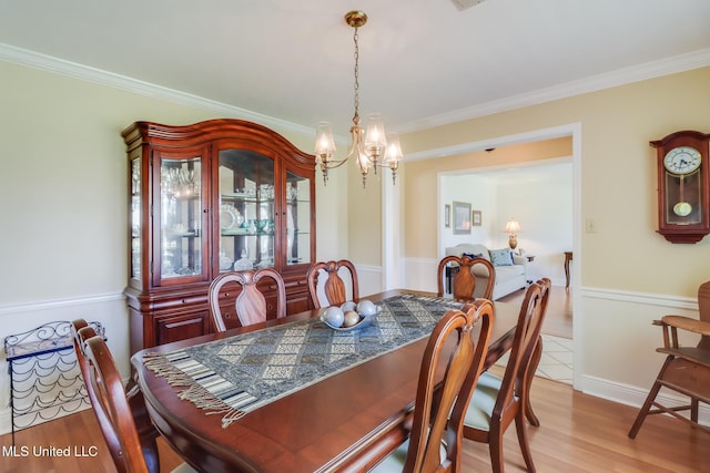 1 Partridge Pl, Long Beach, MS 39560 - dining area featuring a chandelier, crown molding, and light wood finished floors