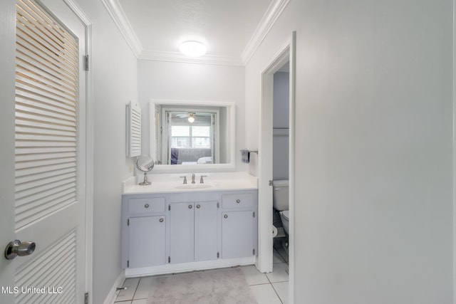 1 Partridge Pl, Long Beach, MS 39560 - bathroom with tile patterned floors, toilet, ornamental molding, vanity, and baseboards