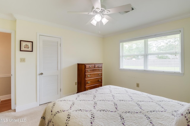 1 Partridge Pl, Long Beach, MS 39560 - bedroom with ornamental molding, light colored carpet, a closet, baseboards, and a ceiling fan
