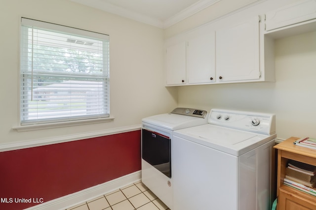 1 Partridge Pl, Long Beach, MS 39560 - laundry room with washing machine and clothes dryer, plenty of natural light, baseboards, cabinet space, and crown molding
