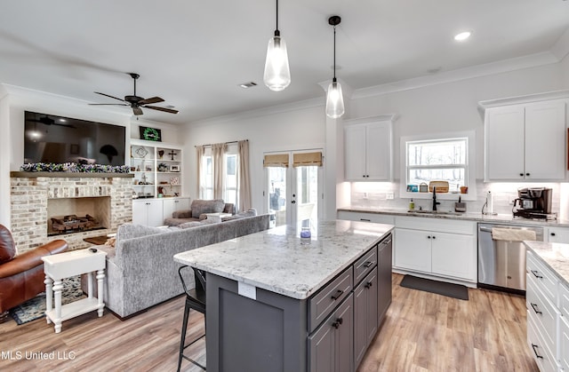 kitchen featuring sink, white cabinetry, gray cabinets, dishwasher, and a kitchen island