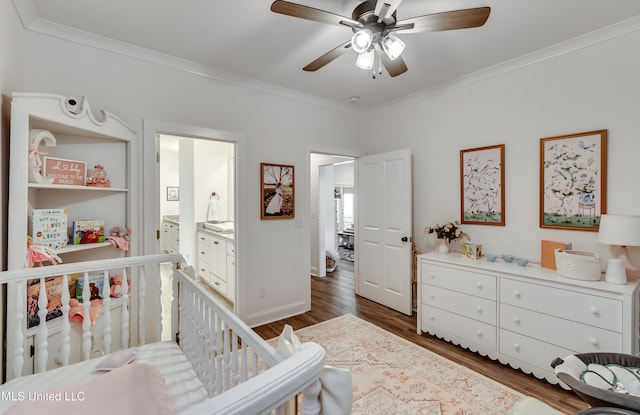 bedroom with crown molding, ceiling fan, and dark hardwood / wood-style flooring