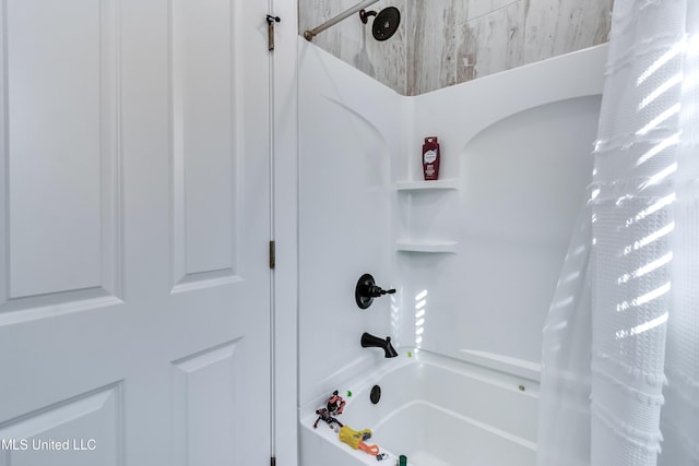 bathroom with shower / bath combination with curtain