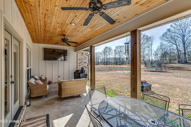 view of patio / terrace featuring an outdoor living space, a trampoline, and ceiling fan