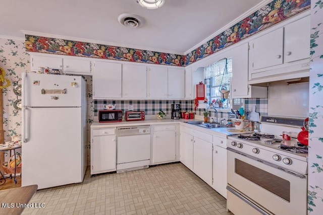 kitchen with crown molding, sink, white cabinets, and white appliances