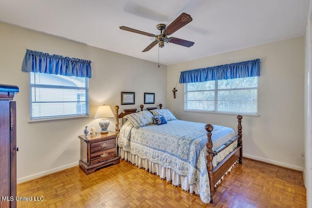 bedroom featuring ceiling fan and parquet flooring