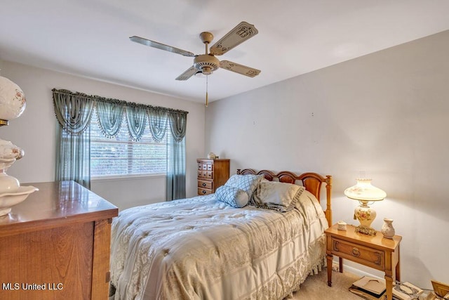 bedroom with ceiling fan and carpet flooring