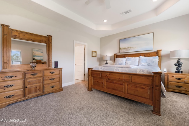 16872 W Landon Green Cir, Gulfport, MS 39503 - bedroom with light carpet, a tray ceiling, ceiling fan, recessed lighting, and baseboards