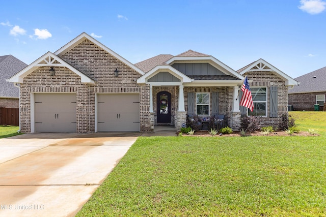 16872 W Landon Green Cir, Gulfport, MS 39503 - craftsman house with brick siding, driveway, an attached garage, a front lawn, and board and batten siding