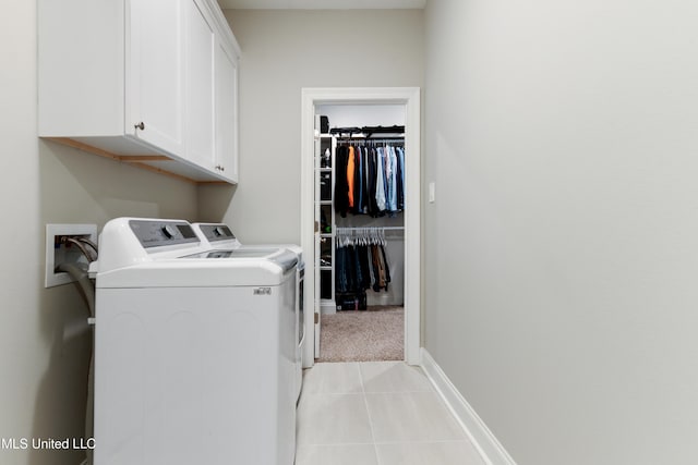 16872 W Landon Green Cir, Gulfport, MS 39503 - laundry area with cabinet space, washer and clothes dryer, light carpet, light tile patterned floors, and baseboards