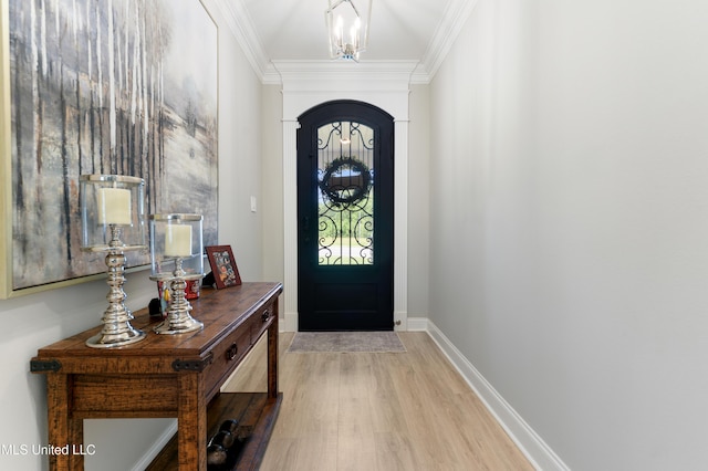 16872 W Landon Green Cir, Gulfport, MS 39503 - foyer with wood finished floors, arched walkways, crown molding, and baseboards