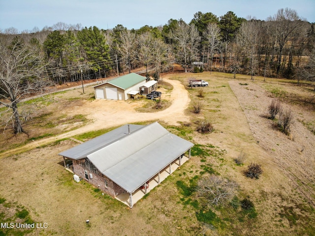 drone / aerial view featuring a forest view