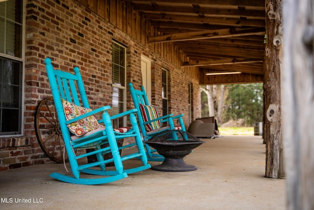 view of patio with a fire pit